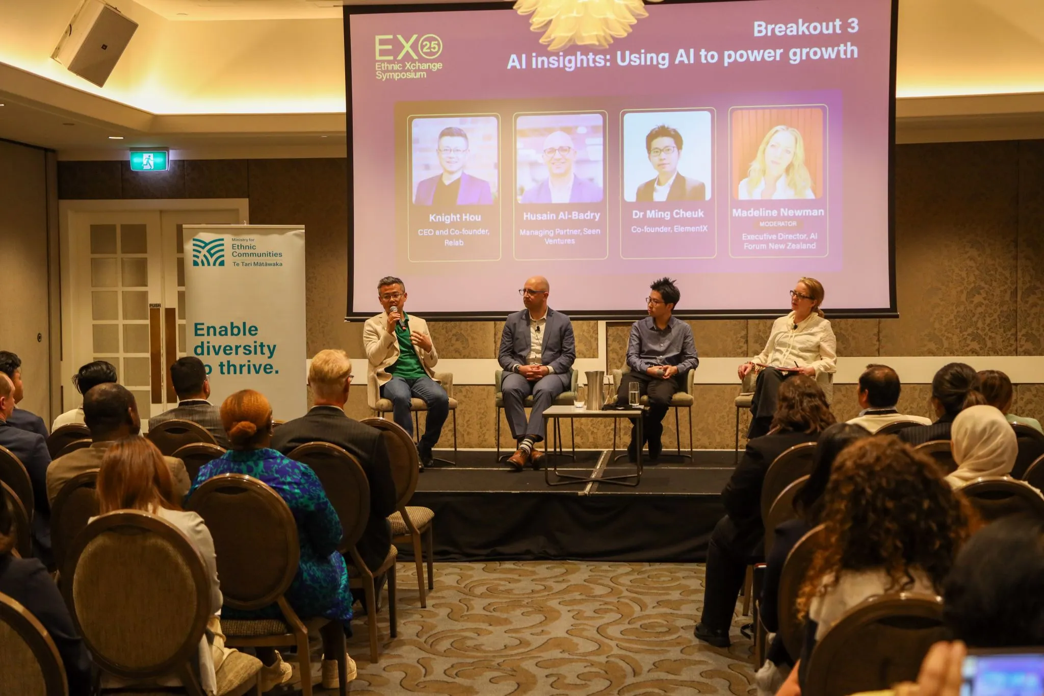 Dr Ming Cheuk seated on an AI panel at the Ethnic Xchange Symposium
