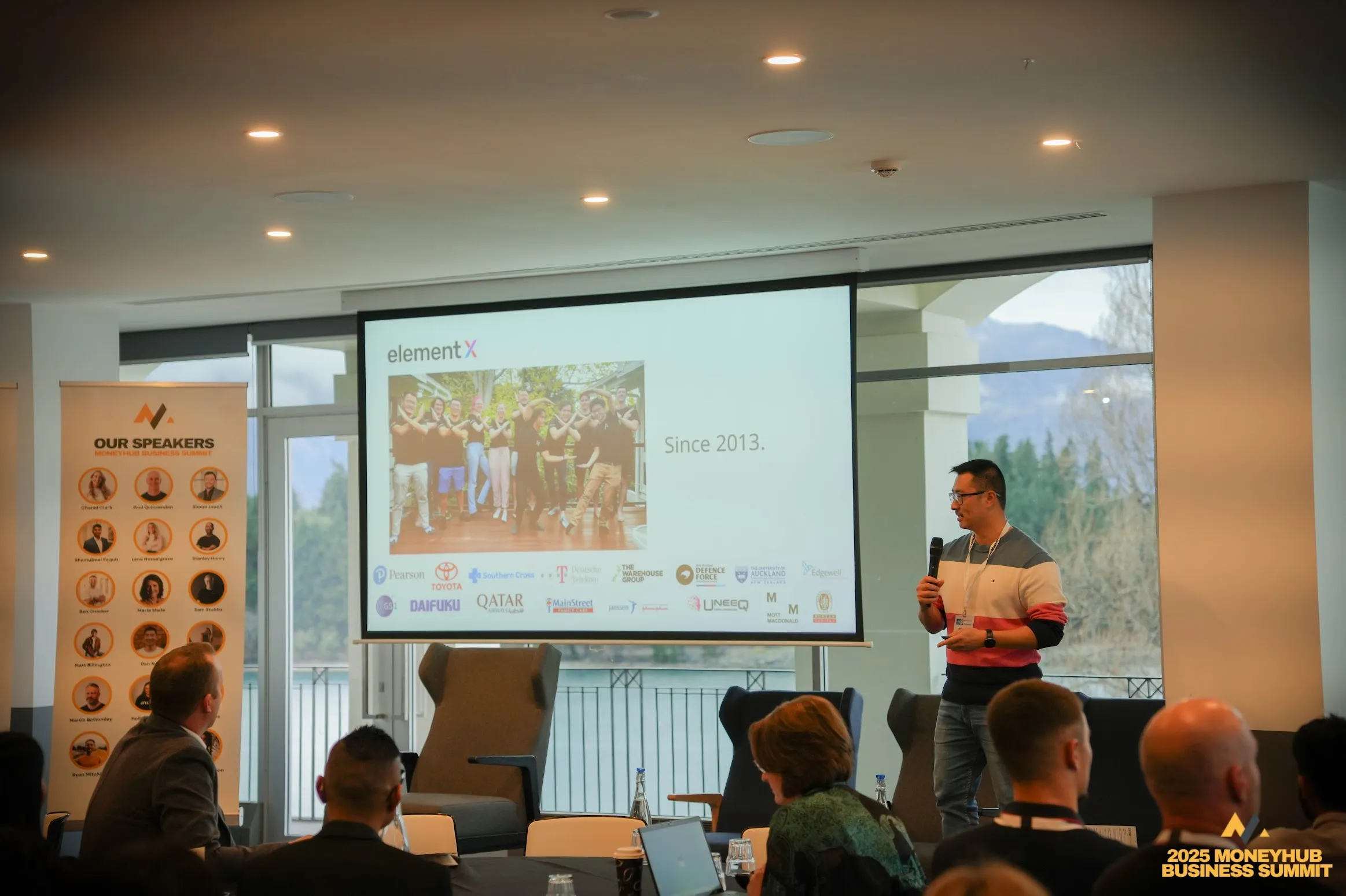An ElementX founder presenting on stage at the 2025 MoneyHub Business Summit